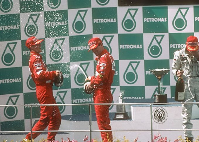 Michael Schumacher, Eddie Irvine, 1999 Malaysian Grand Prix